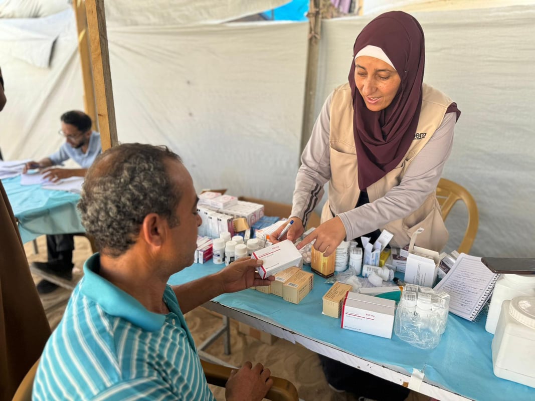 A man receiving medications in Gaza from a local NGO partner